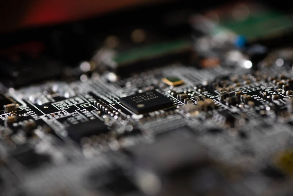 Laptop motherboard chip detail during a component-level repair